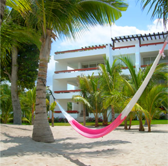 relax in a hammock, after a morning scuba dive trip from the pier.